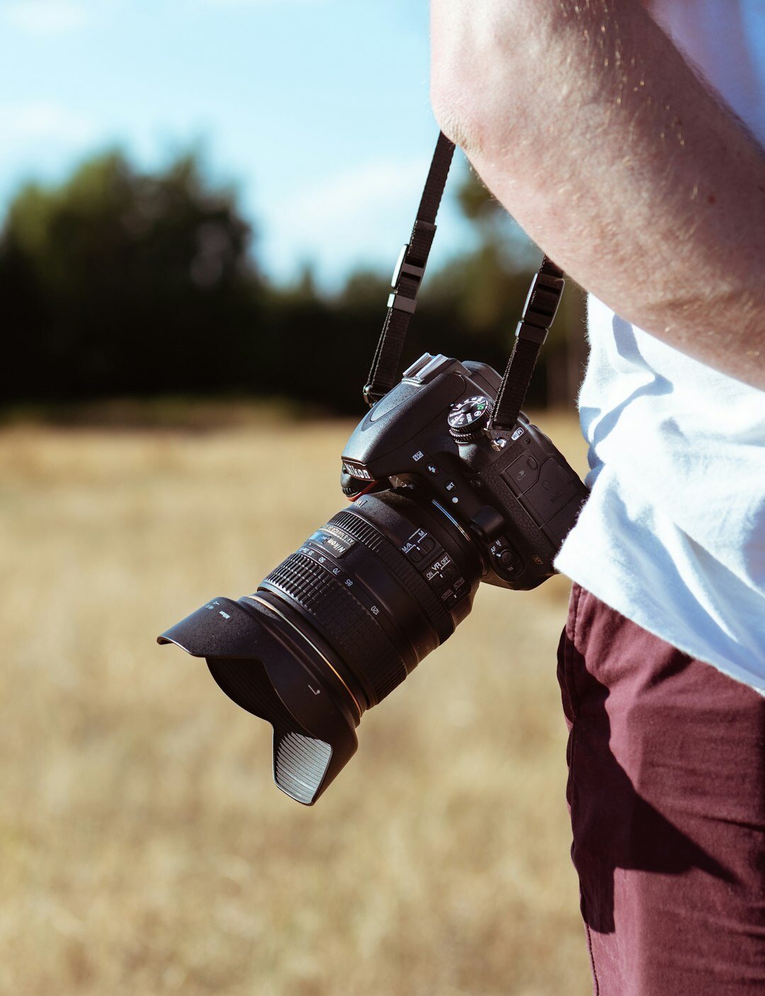photographer with camera in field