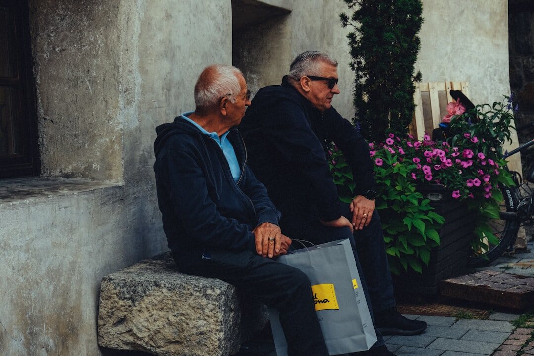 elderly men talking outside