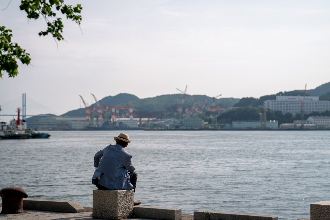 elderly fisherman by harbor
