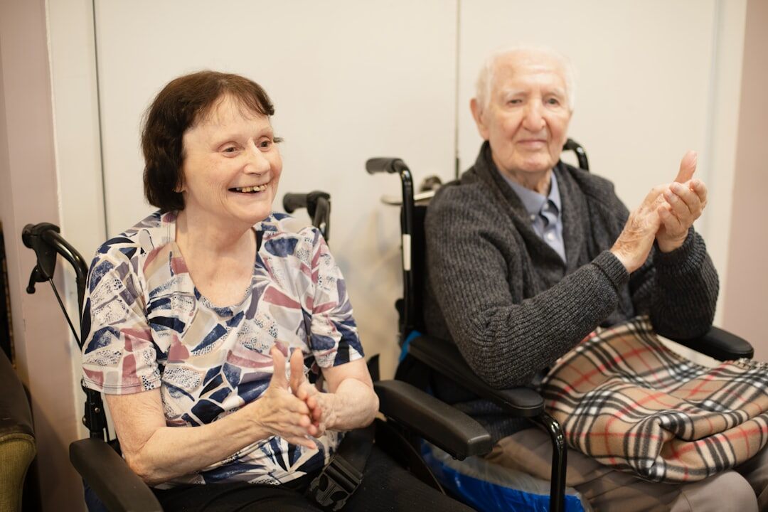 Elderly Danish residents sitting together in a care home common room