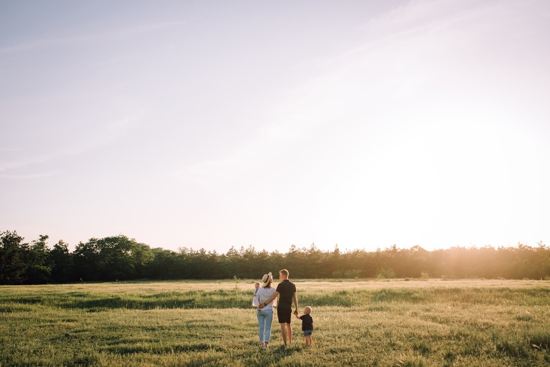 A Danish farming family working together in a countryside field