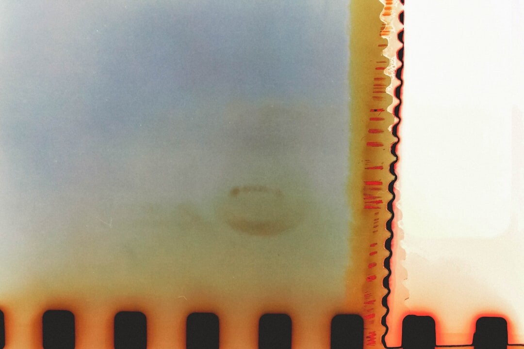 Film negatives and contact sheets spread out on a light table