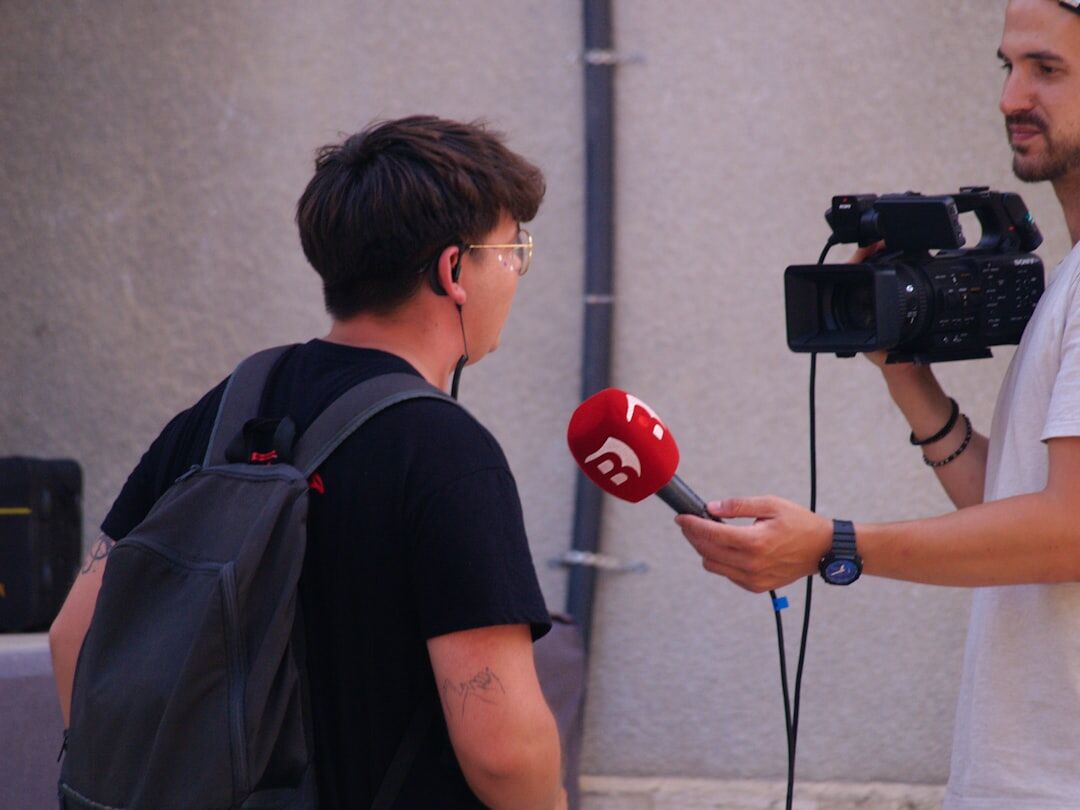 documentary photographer interviewing local